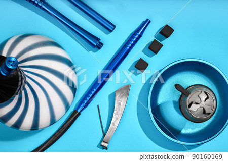 Top view of Hookah parts on light blue background 90160169