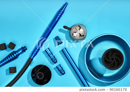 Top view of Hookah parts on light blue background 90160178
