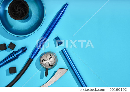 Top view of Hookah parts on light blue background 90160192