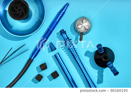 Top view of Hookah parts on light blue background 90160195