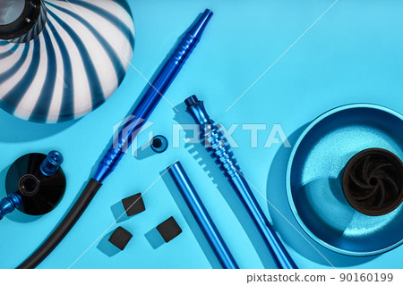 Top view of Hookah parts on light blue background 90160199