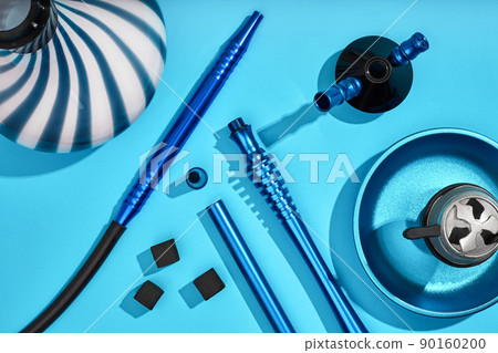 Top view of Hookah parts on light blue background 90160200