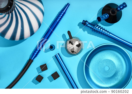 Top view of Hookah parts on light blue background 90160202