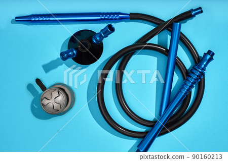 Top view of Hookah parts on light blue background Top view of Hookah parts on light blue background 90160213