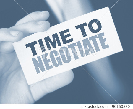 Time to negotiate words on a card in businessman's pocket. Compromise in business concept Time to negotiate words on a card in businessman's pocket. Compromise in business concept 90160820
