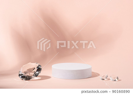 White podium with diamonds on a pink background for product presentation. Minimal concept and hard sunlight. 90160890
