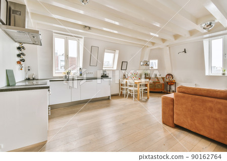 Kitchen in a new luxury house with modern appliances, parquet floors, white cabinets Kitchen in a new luxury house with modern appliances, parquet floors, white cabinets 90162764