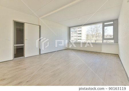 Plastic window and radiator on white wall in empty light room at home Plastic window and radiator on white wall in empty light room at home 90163119