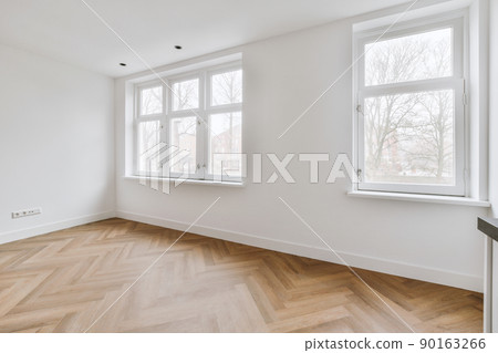 An empty room with two windows and good brightness An empty room with two windows and good brightness 90163266