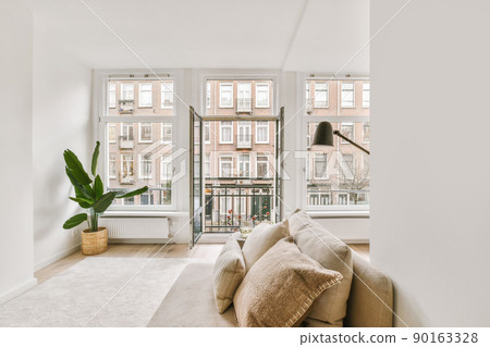 Front view of old brick buildings from small balcony with railings 90163328