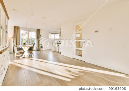 Bright home interior with table and way to kitchen 90163608