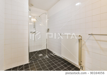 Modern shower stall in a bright bathroom Modern shower stall in a bright bathroom 90164056