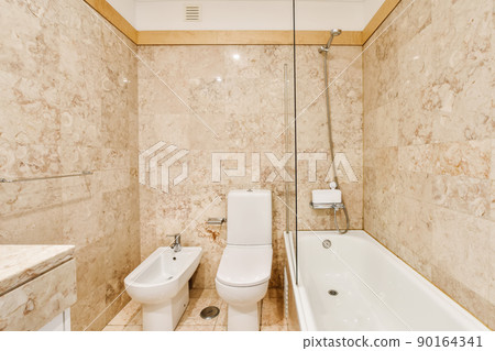 Luxury bathroom design with beige marble and tiled floor Luxury bathroom design with beige marble and tiled floor 90164341
