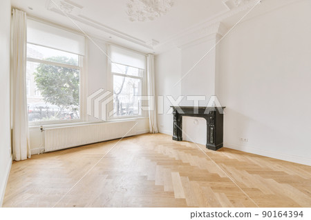 Large empty spacious bright white loft room with windows Large empty spacious bright white loft room with windows 90164394