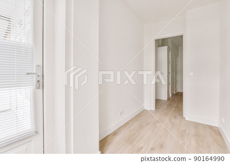 Spacious hallway interior with parquet floor and entrance to the cozy house Spacious hallway interior with parquet floor and entrance to the cozy house 90164990