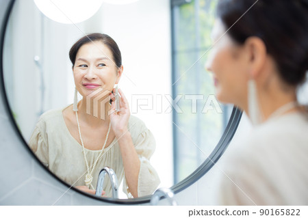 A fashionable woman in her 60s A fashionable woman in her 60s 90165822