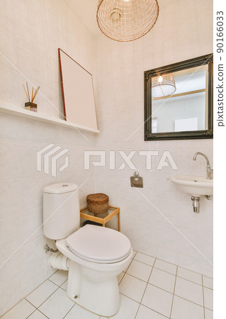 Interior of small clean restroom in miniature style 90166033