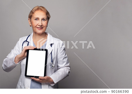 Happy doctor with tablet pc with empty white display touchscreen over blue background Happy doctor with tablet pc with empty white display touchscreen over blue background 90166390