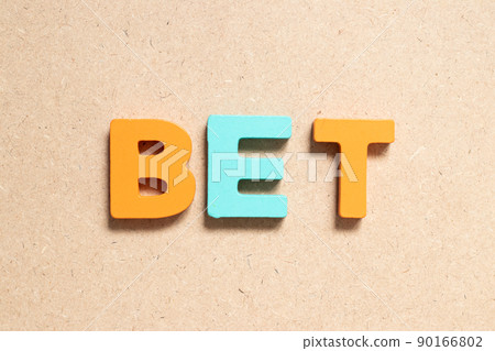 Color alphabet letter in word bet on wood background Color alphabet letter in word bet on wood background 90166802