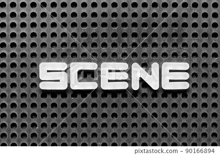 White alphabet letter in word scene on black pegboard background White alphabet letter in word scene on black pegboard background 90166894