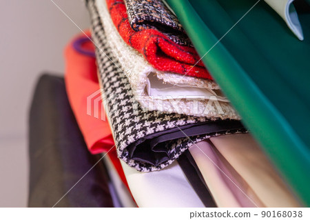 Fashionable tailored tweed clothing in atelier. Modern premium quality hand made woman's fashion Fashionable tailored tweed clothing in atelier. Modern premium quality hand made woman's fashion 90168038
