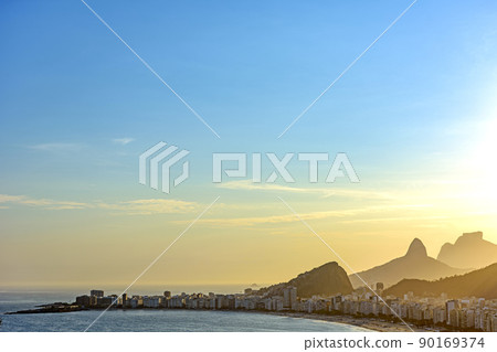 Copacabana Beach, its buildings and the mountains of Rio de Janeiro Copacabana Beach, its buildings and the mountains of Rio de Janeiro 90169374