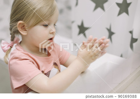 Little toddler girl in bathroom washing hands. Healthy, Child Hygiene concept. 90169388