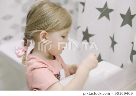 Little toddler girl in bathroom washing hands. Healthy, Child Hygiene concept. 90169469