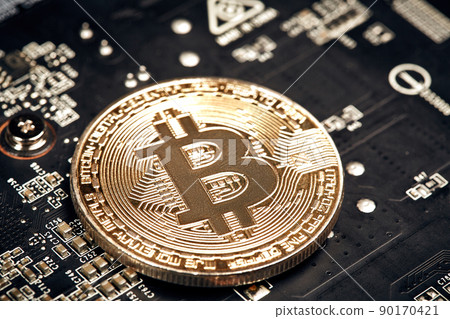 Bitcoin. New virtual money. Bitcoins lie on the video card, concept of mining. Bitcoin. New virtual money. Bitcoins lie on the video card, concept of mining. 90170421