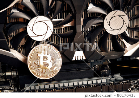 Bitcoin. New virtual money. Bitcoins lie on the video card, concept of mining. 90170433
