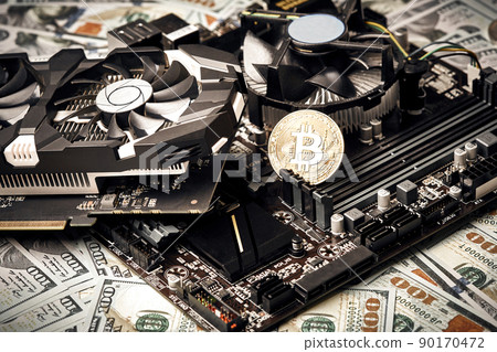 The coin of bitcoin lies on video card with dollars. Exchange bitcoin cash for a dollar 90170472