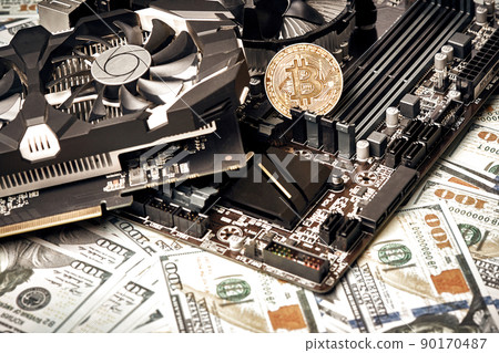 The coin of bitcoin lies on video card with dollars. Exchange bitcoin cash for a dollar 90170487