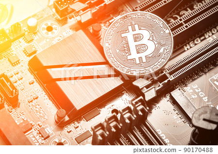 Bitcoin. New virtual money. Bitcoins lie on the video card, concept of mining. Sun flare Bitcoin. New virtual money. Bitcoins lie on the video card, concept of mining. Sun flare 90170488