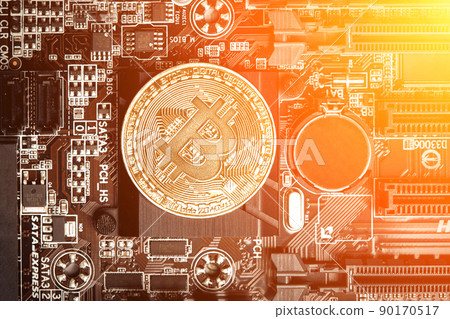 Bitcoin. New virtual money. Bitcoins lie on the video card, concept of mining. Sun flare 90170517