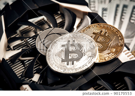 The coin of bitcoin lies on video card with dollars. Exchange bitcoin cash for a dollar 90170553