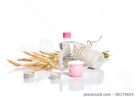 Herbal and mineral skincare. Jar of cream, oil with wheat, cosmetic bottles. Without label Herbal and mineral skincare. Jar of cream, oil with wheat, cosmetic bottles. Without label 90170603
