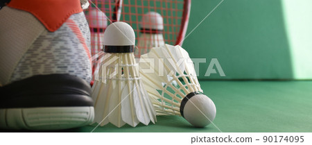 Badminton sports equipments, racket, shuttlecocks and shoes, on court, Badminton sports equipments, racket, shuttlecocks and shoes, on court, 90174095