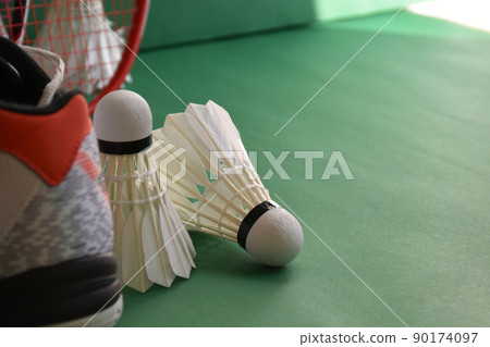 Badminton sports equipments, racket, shuttlecocks and shoes, on court, Badminton sports equipments, racket, shuttlecocks and shoes, on court, 90174097