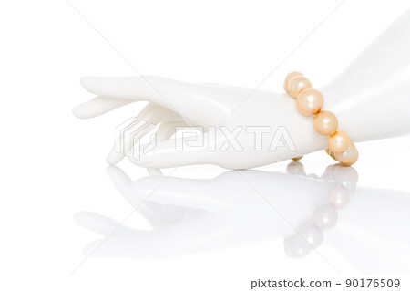 Freshwater pearl bracelet on plastic mannequin female hand. Collection of luxury jewelry accessories. Studio shot Freshwater pearl bracelet on plastic mannequin female hand. Collection of luxury jewelry accessories. Studio shot 90176509