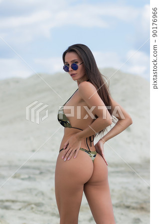 Beautiful woman in swimsuit on beach 90176966