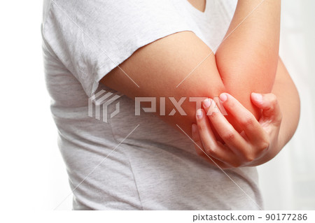 Man in pain in his arm Man in pain in his arm 90177286