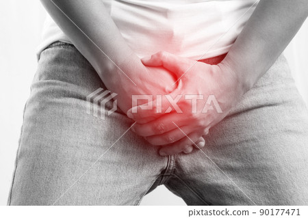 man covers groin, health problems disease for premature ejaculation, fertility, erection. The concept of protection of sexually transmitted infections. prostate problem testicular cancer. 90177471