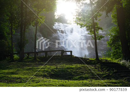 Wachirathan Waterfall at Doi Inthanon National Park, Chiang Mai Province, Thailand.  A famous waterfall in a tropical rainforest on Doi Inthanon, Thailand. 90177839