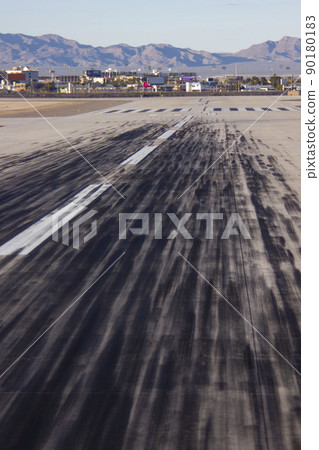 Runway and landscape full of airplane wheels 90180183