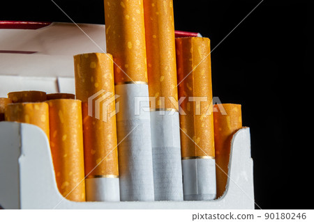 Close up cigarette in pack is addictive to be cancer.smoking reduction campaign in World No Tobacco Close up cigarette in pack is addictive to be cancer.smoking reduction campaign in World No Tobacco 90180246