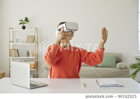 Happy woman in vr glasses explore modern technologies 90182025