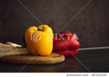 bright appetizing yellow and red peppers style of fine art 90182596