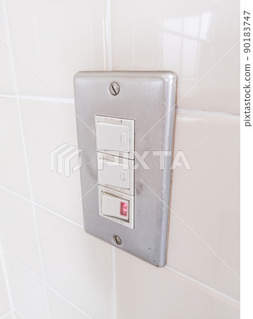 The lighting on the tile wall is switched on The lighting on the tile wall is switched on 90183747