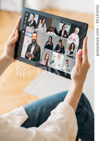 Online business event. Video call. Corporate telecommuting. Professional team working online discussing presentation on tablet screen at digital office. Online business event. Video call. Corporate telecommuting. Professional team working online discussing presentation on tablet screen at digital office. 90183842