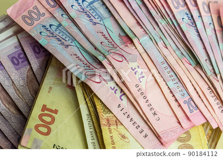 Paper money different denominations, Ukrainian hryvnia in denominations 50,100, 200 hryvnias, new money, background with scattered banknotes 90184112